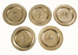 A set of five Alice In Wonderland brass chargers -0