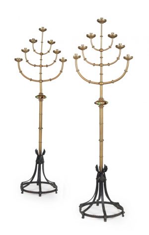 A pair of English School Gothic Revival  brass standing candelabra.