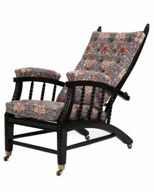 A Morris & Co. ebonised reclining chair -0