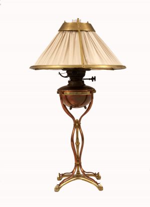 An Arts & Crafts brass and copper table lamp