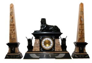 An Egyptian Revival clock garniture