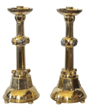 A pair of Arts & Crafts brass candlesticks